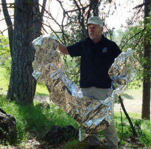 Survival expert Skip Stoffel demonstrates how fragile a mylar blanket is in a survival situation. (Blake Miller photo)