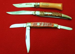 The Opinel, top, and the Puma Birdhunter, bottom, both offer a lot. The folding fish knife in the center is also a useful design.