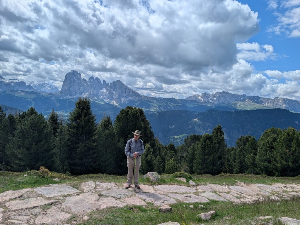 man hiking in Ortisei Italy