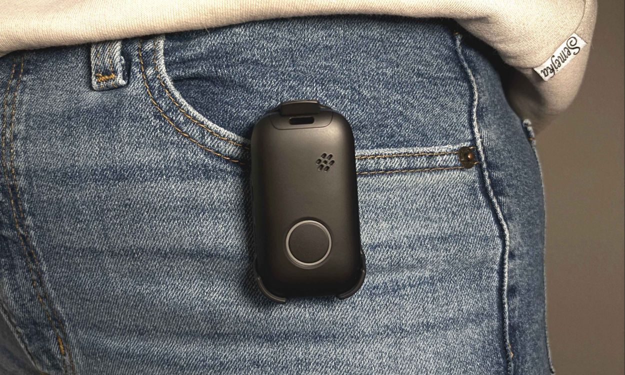 personal alert mobile device clipped to a jeans pocket