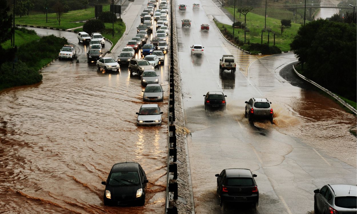 flooded streets and cars trying to drive on it