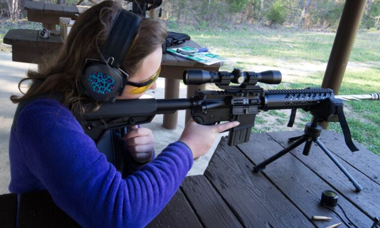 woman target practicing with AR 15