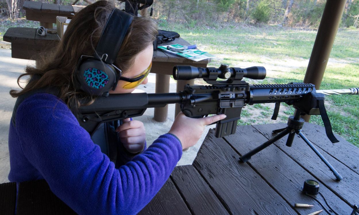 woman target practicing with AR 15